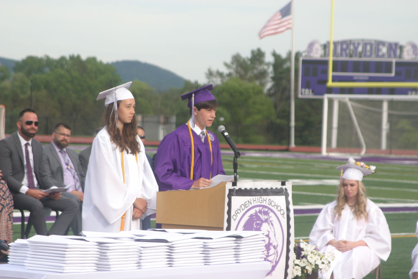 Valedictorian Jackson Crocker (right) delivers a speech alongside salutatorian Heidi Nydam (left) at the Dryden High School graduation ceremony on June 25. Dryden graduated 107 seniors in the 2020–2021 academic year.